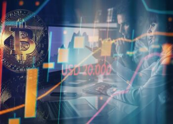 moneda de bitcoin con gráfico de precio ascendente sobre marca de usd 20.000 con traders analizando pantalla en el fondo