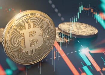 Bitcoin junto a gráfico que sube y baja.