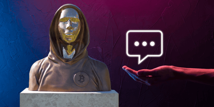 Satoshi Nakamoto con mano y globo de conversación