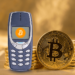 Celular sin internet junto a bitcoin.