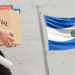 PAXFUL junto a bandera de El Salvador.