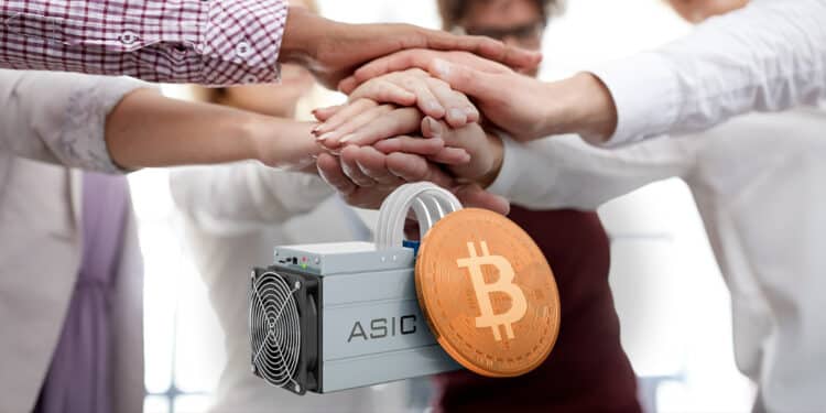 Manos en colaboración con minero asic de bitcoin