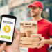 Delivery y persona pagando con bitcoin.
