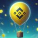 Un globo en el cielo dejando caer monedas.