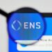 Milan, Italy - January 11, 2022: ethereum name service - ENS website's hp. ethereum name service, ENS coin logo visible through a loope. Defi, ntf, cryptocurrency concepts illustrative editorial.