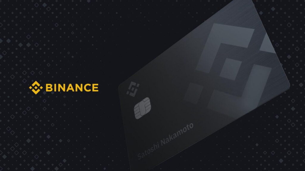 Tarjeta de débito de Binance: fondo oscuro con logotipo de Binance y red Mastercard/Visa, chip metálico, estilo de tarjeta clásica.