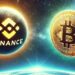 un orbe de binance y uno de bitcoin sobrevolando el espacio