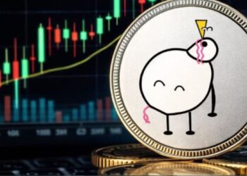 Una moneda con el logo de PIPPIN delante de una pantalla de gráfico de precios.